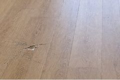 Illustration: scratch in the floorboards by a bedroom door